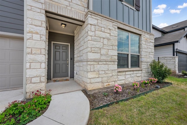713 Hummingbird Ln, Leander, TX 78641 - view of exterior entry featuring board and batten siding and stone siding