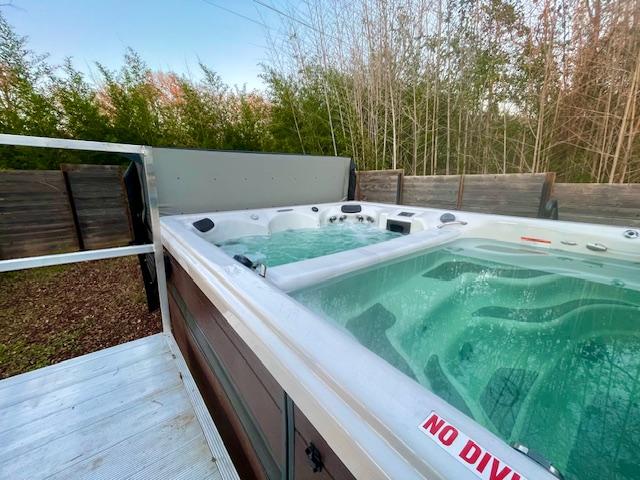 192 W Kaanapali Ln, Bastrop, TX 78602 - view of swimming pool featuring a hot tub