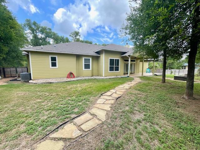 192 W Kaanapali Ln, Bastrop, TX 78602 - back of property featuring central AC