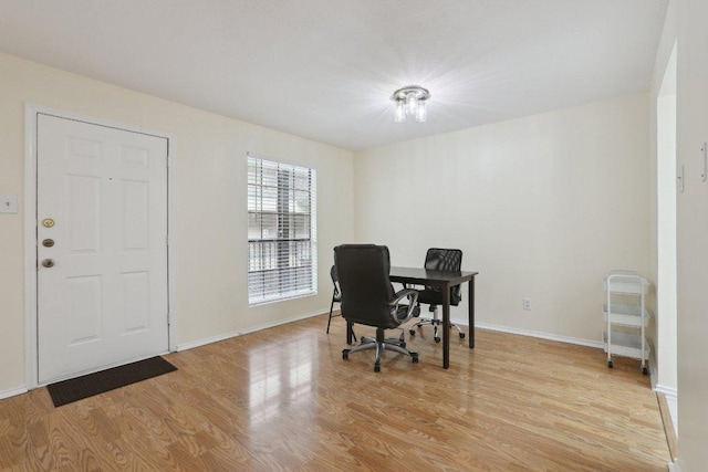 2401 Leon St Unit 210, Austin, TX 78705 - dining room featuring light wood-type flooring, a desk, and baseboards