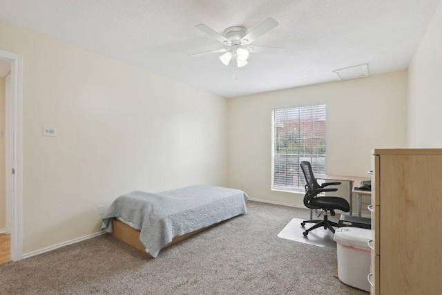 2401 Leon St Unit 210, Austin, TX 78705 - bedroom with carpet flooring, baseboards, an office area, ceiling fan, and a textured ceiling