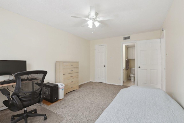 carpeted bedroom with baseboards, ceiling fan, connected bathroom, and visible vents