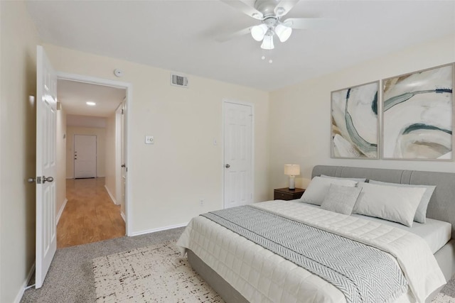 2401 Leon St Unit 210, Austin, TX 78705 - carpeted bedroom with baseboards and a ceiling fan