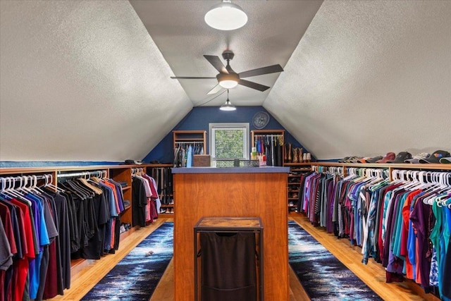 550 League Line Rd, Smithville, TX 78957 - spacious closet featuring wood finished floors, a ceiling fan, and lofted ceiling