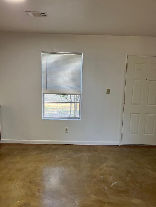 102 Rose Dr, Dripping Springs, TX 78620 - spare room with visible vents, concrete floors, and baseboards