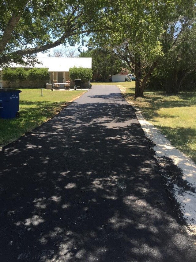 102 Rose Dr, Dripping Springs, TX 78620 - view of road featuring aphalt driveway