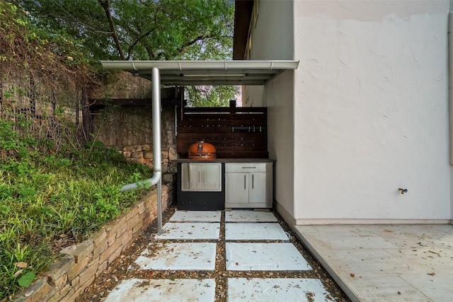 13606 Montview Dr, Austin, TX 78732 - view of patio with an outdoor kitchen