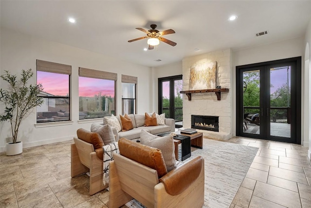 13606 Montview Dr, Austin, TX 78732 - living room with ceiling fan, recessed lighting, a fireplace, and baseboards
