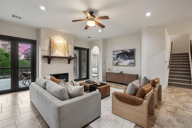 13606 Montview Dr, Austin, TX 78732 - living area featuring ceiling fan, stairs, recessed lighting, a stone fireplace, and french doors