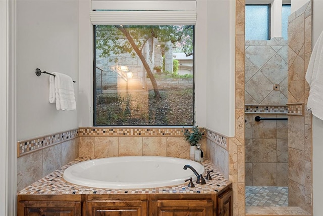 13606 Montview Dr, Austin, TX 78732 - full bath with healthy amount of natural light, a garden tub, and a tile shower