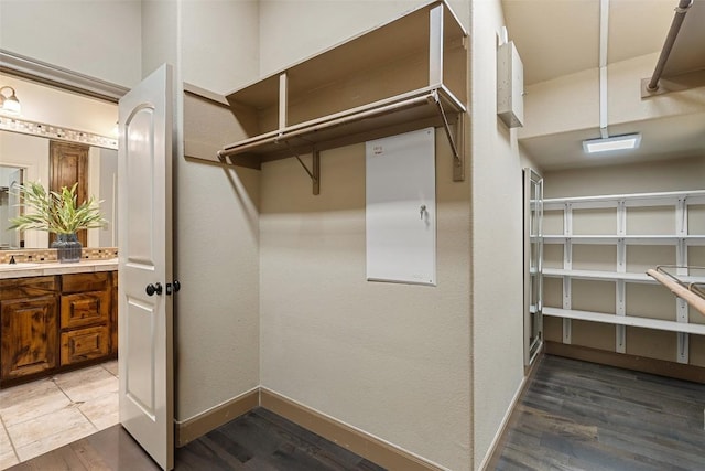 13606 Montview Dr, Austin, TX 78732 - walk in closet with wood finished floors
