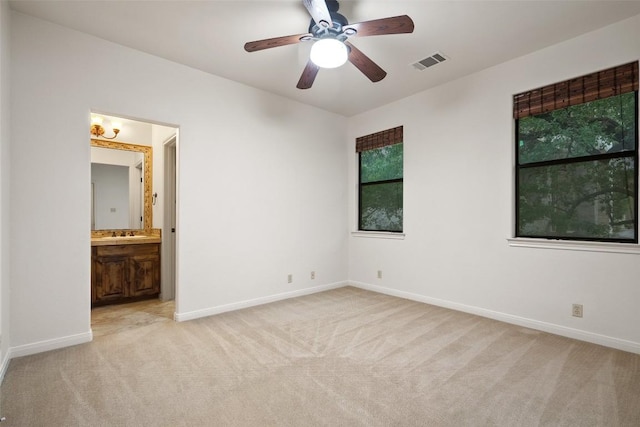 13606 Montview Dr, Austin, TX 78732 - unfurnished bedroom with light colored carpet, baseboards, and a sink