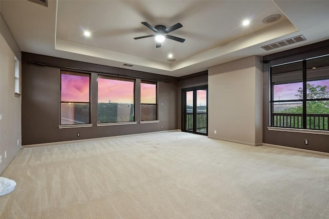 13606 Montview Dr, Austin, TX 78732 - empty room with a tray ceiling, carpet flooring, ceiling fan, and recessed lighting