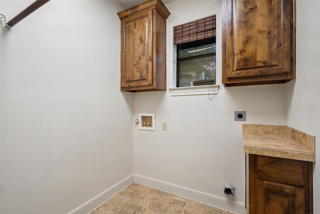 13606 Montview Dr, Austin, TX 78732 - laundry area featuring electric dryer hookup, baseboards, washer hookup, and cabinet space