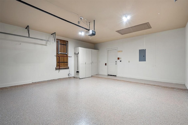 13606 Montview Dr, Austin, TX 78732 - garage with electric panel, baseboards, and a garage door opener