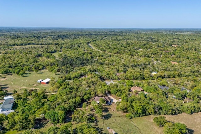 146 Kingwood Dr, Elgin, TX 78621 - aerial view of property and surrounding area featuring a heavily wooded area
