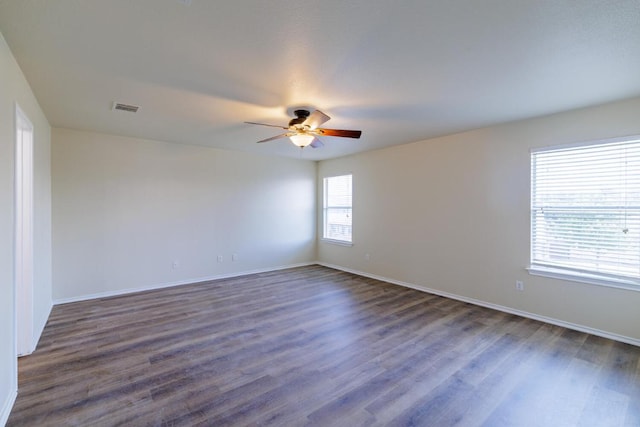 157 Brickyard Ln, Jarrell, TX 76537 - spare room featuring ceiling fan, dark wood-style floors, and baseboards