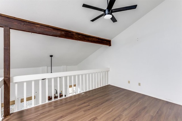 additional living space featuring vaulted ceiling with beams, wood finished floors, and a ceiling fan