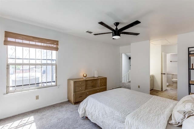 bedroom featuring carpet, visible vents, and multiple windows