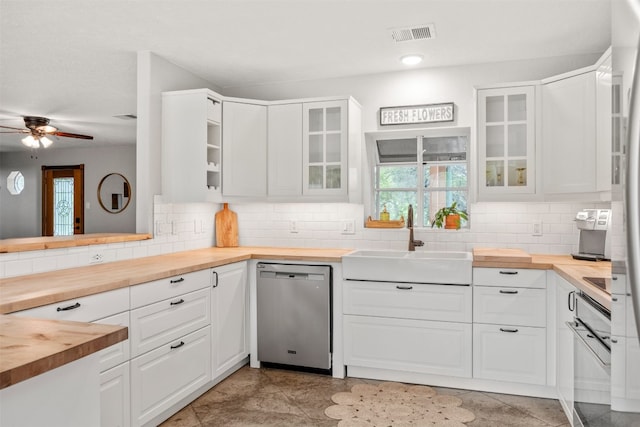 12099 Bonham Ranch Rd, Dripping Springs, TX 78620 - kitchen featuring wood counters, stainless steel dishwasher, a sink, and a ceiling fan