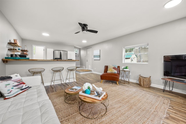 12099 Bonham Ranch Rd, Dripping Springs, TX 78620 - living room featuring wood finished floors, ceiling fan, baseboards, and recessed lighting