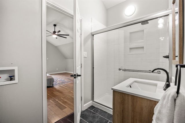 12099 Bonham Ranch Rd, Dripping Springs, TX 78620 - full bath with ceiling fan, a shower stall, baseboards, lofted ceiling, and vanity
