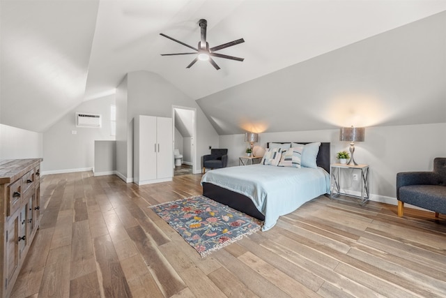 12099 Bonham Ranch Rd, Dripping Springs, TX 78620 - bedroom with light wood finished floors, vaulted ceiling, baseboards, and ceiling fan