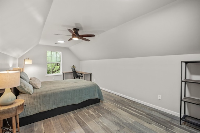 12099 Bonham Ranch Rd, Dripping Springs, TX 78620 - bedroom featuring wood finished floors, vaulted ceiling, baseboards, and ceiling fan