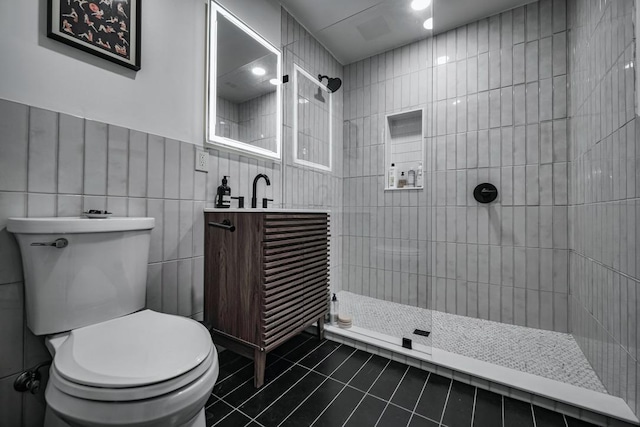 2928 E 13th St Unit B, Austin, TX 78702 - full bath with a tile shower, toilet, tile patterned flooring, and tile walls
