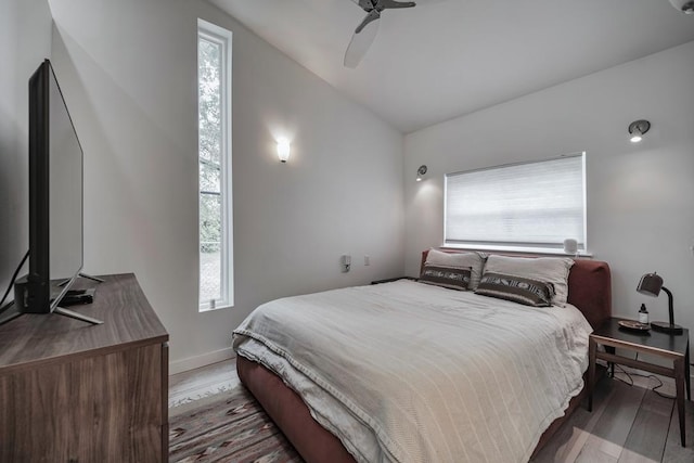 2928 E 13th St Unit B, Austin, TX 78702 - bedroom featuring ceiling fan, lofted ceiling, wood finished floors, and baseboards