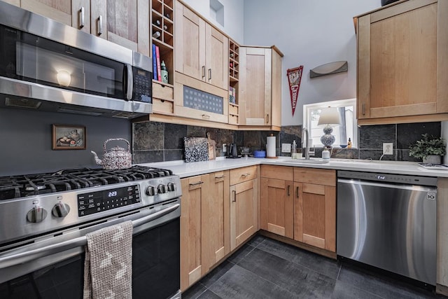 2928 E 13th St Unit B, Austin, TX 78702 - kitchen with light countertops, a sink, decorative backsplash, light brown cabinets, and appliances with stainless steel finishes