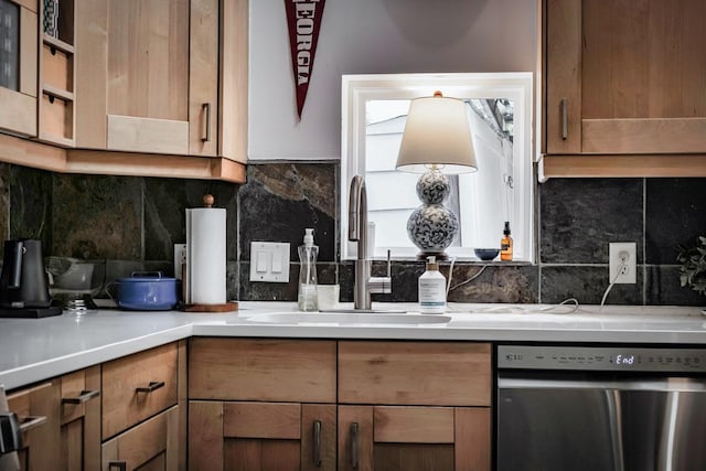 2928 E 13th St Unit B, Austin, TX 78702 - kitchen featuring stainless steel dishwasher, light countertops, a sink, and tasteful backsplash