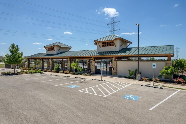 view of property featuring uncovered parking