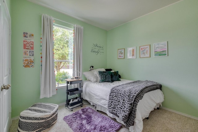 bedroom with carpet and baseboards