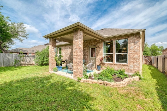 back of property featuring brick siding and a patio