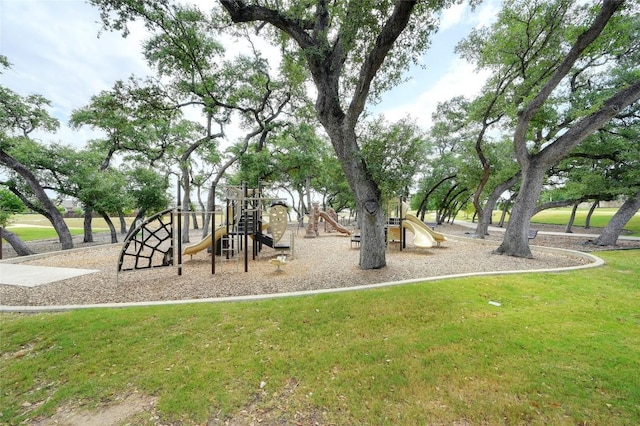 community jungle gym featuring a lawn