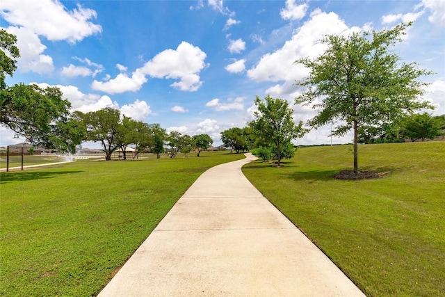 view of home's community featuring a lawn