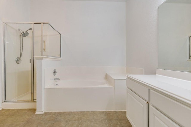1901 Rachel Ln, Round Rock, TX 78664 - bathroom with a garden tub, vanity, a stall shower, and tile patterned flooring