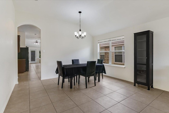 1901 Rachel Ln, Round Rock, TX 78664 - dining area with arched walkways, light tile patterned floors, baseboards, a chandelier, and a ceiling fan