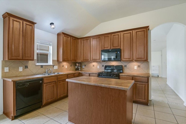 1901 Rachel Ln, Round Rock, TX 78664 - kitchen with black appliances, a sink, arched walkways, lofted ceiling, and light tile patterned floors