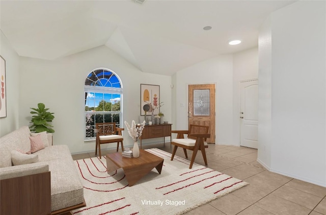 1901 Rachel Ln, Round Rock, TX 78664 - sitting room featuring vaulted ceiling and light tile patterned flooring