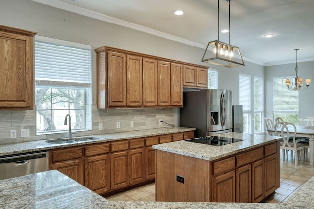 3803 Bobby Jones Way, Round Rock, TX 78664 - kitchen with stainless steel appliances, brown cabinets, backsplash, a chandelier, and crown molding
