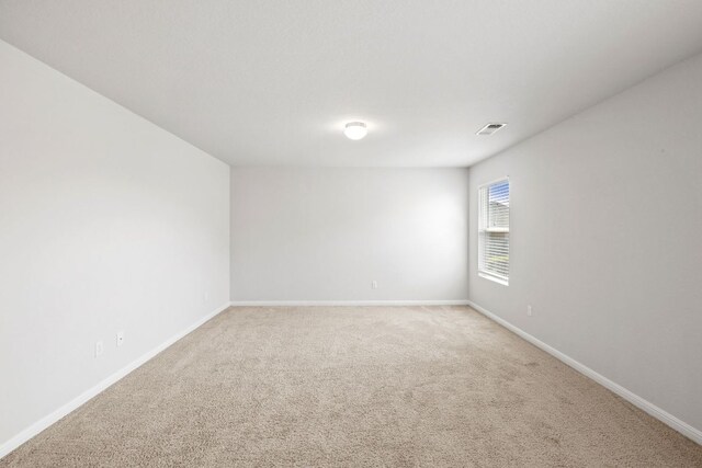 17717 Zinfandel Dr, Pflugerville, TX 78660 - spare room with light colored carpet, baseboards, and visible vents