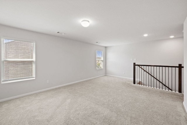 17717 Zinfandel Dr, Pflugerville, TX 78660 - carpeted empty room featuring visible vents, baseboards, and recessed lighting