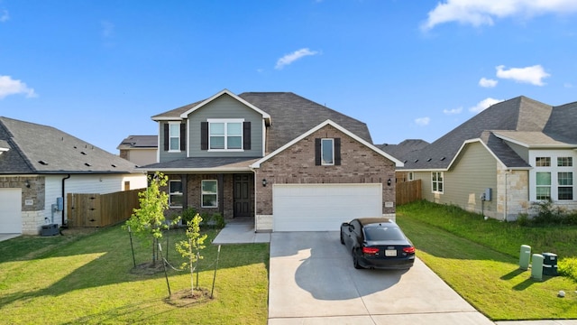 17717 Zinfandel Dr, Pflugerville, TX 78660 - traditional-style house with driveway, fence, brick siding, a garage, and a front yard