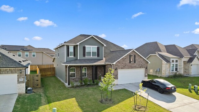 17717 Zinfandel Dr, Pflugerville, TX 78660 - view of front of home featuring a garage, brick siding, a front yard, and concrete driveway