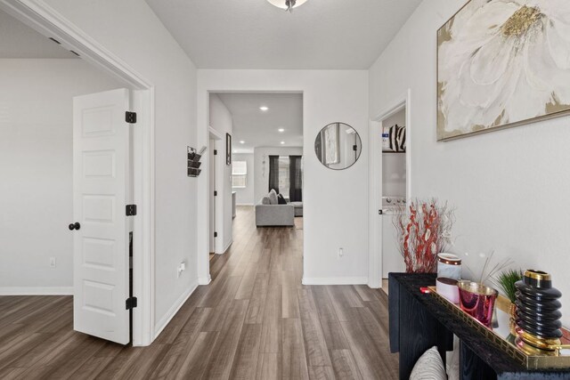 17717 Zinfandel Dr, Pflugerville, TX 78660 - corridor featuring dark wood-type flooring, baseboards, and recessed lighting