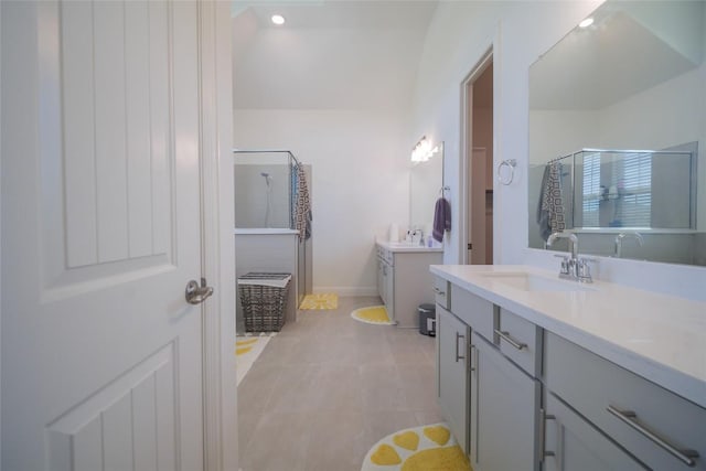 3049 Sage Ranch Dr, Leander, TX 78641 - full bath featuring two vanities, a shower stall, tile patterned floors, and recessed lighting