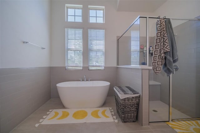 3049 Sage Ranch Dr, Leander, TX 78641 - full bath with plenty of natural light, a tile shower, a soaking tub, tile walls, and tile patterned floors