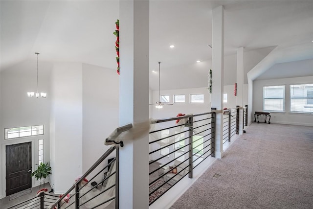3049 Sage Ranch Dr, Leander, TX 78641 - hallway with a chandelier, carpet flooring, high vaulted ceiling, and an upstairs landing